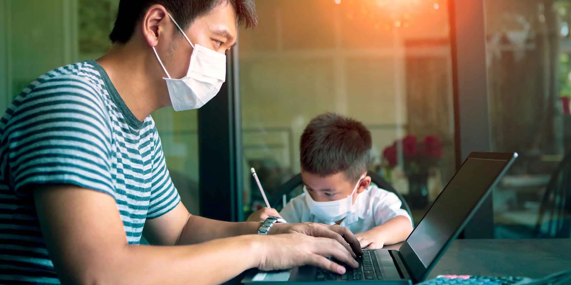 Image of a person working from home on laptop