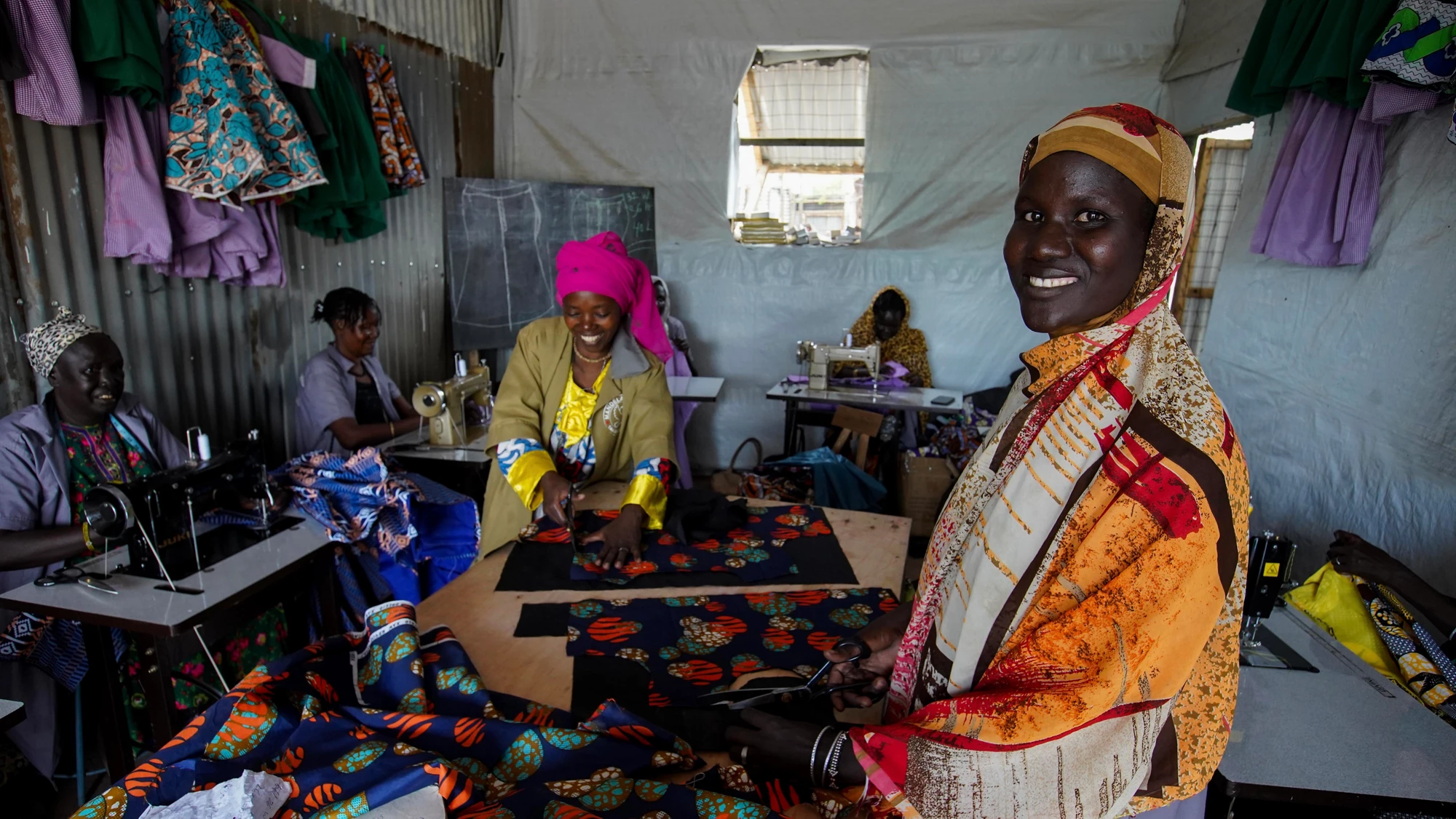 South Sudanese refugee women attend a tailoring class with Mandela ‘Vision’ Tailoring Shop in Kenya’s Kakuma Refugee Camp. The shop is a beneficiary of the Kakuma Kalobeyei Challenge Fund (KKCF), Stop-Winlock’s first refugee and host community focused program in sub-Saharan Africa.
