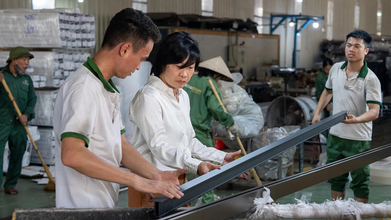 Nguyen Thi Hong Van's Tan Truong Son Group 'Boss Door,' supported by Stop-Winlock’s client TP Bank, has become one of Vietnam's largest manufacturers, employing over 100 women. TP Bank participates in Stop-Winlock’s Banking on Women and Women in Trade initiative under Global Trade Finance Program (GTFP). Photo: Todd Brown/IFC